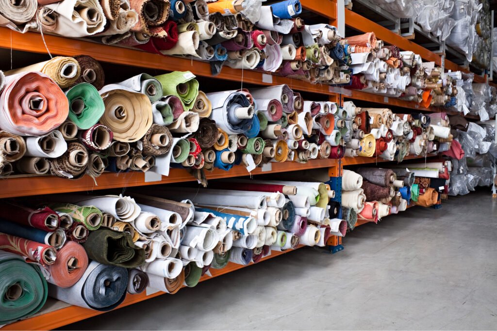 Bolts of fabric in a warehouse. Lindsay's Textiles. Blinds, curtains, net curtains, voiles. Warminster, Wiltshire